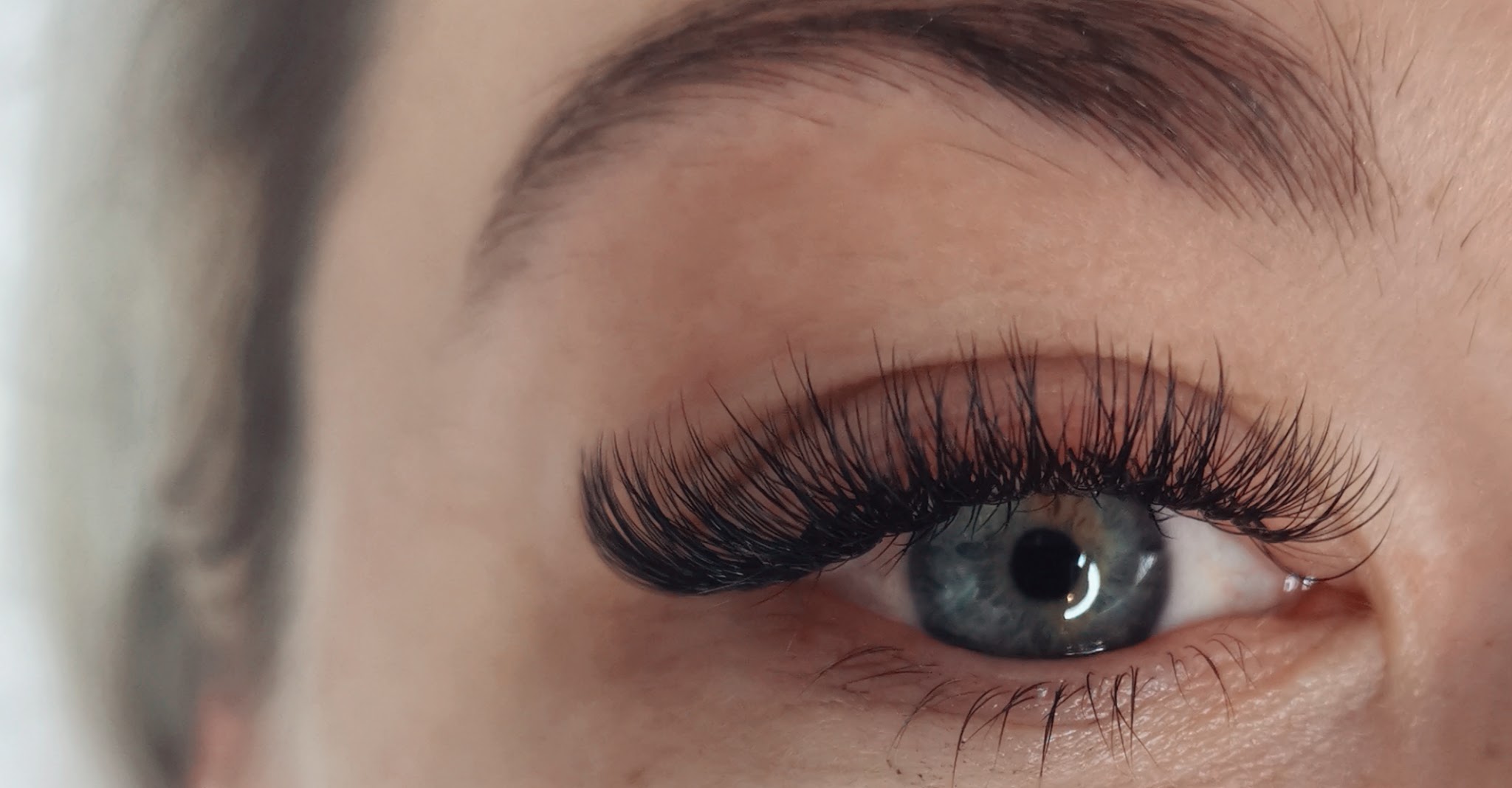 A finished lash set photographed with the brow in frame